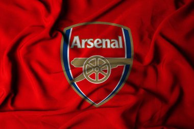 Arsenal logosunun seçici odak noktası. İngiltere Londra Holloway futbol kulübü kumaş dokusuyla. 3B illüstrasyon