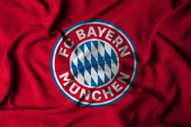 FC Bayern Münih logosunun seçici odak noktası. Münih, Bavyera 'daki futbol kulübü. Akan kumaş dokusuyla. 3B illüstrasyon