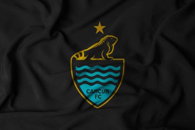 Pringsewu, Lampung; 12 Ağustos 2025; Meksika ikinci ligi futbol liginde Cancn FC futbol takımının logosunu sembolize eden sallanan bir bayrak..