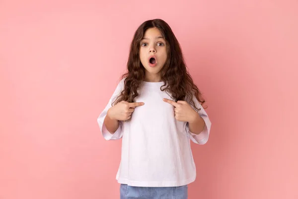 Portrait Surprised Little Girl White Shirt Pointing Finger Herself Looking — Stock Photo, Image