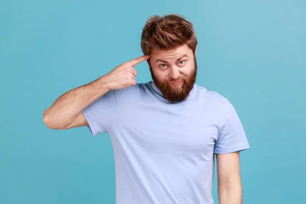 Portrait Young Bearded Man Showing Stupid Gesture Finger Head Out — Foto Stock