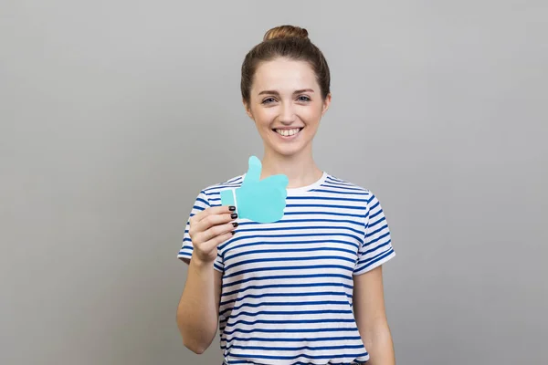 Portrait Woman Wearing Striped Shirt Showing Thumbs Blue Paper Sign — Stock Photo, Image