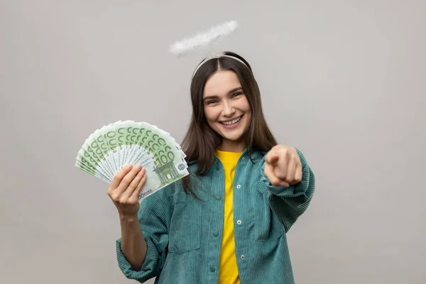 Positive Angelic Young Woman Halo Head Holding Euro Banknotes Pointing — Stock Photo, Image