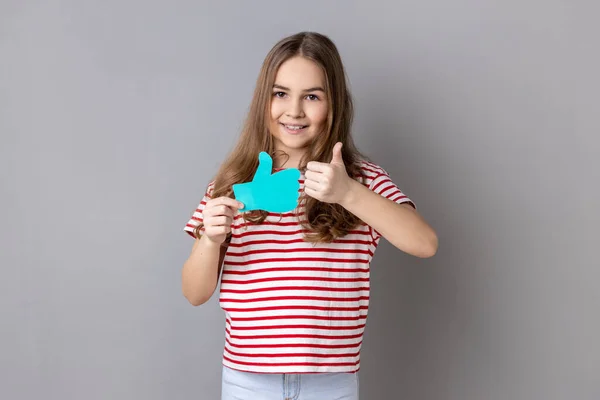 Little Girl Wearing Striped Shirt Holding Thumbs Blue Icon Follower — Stok fotoğraf