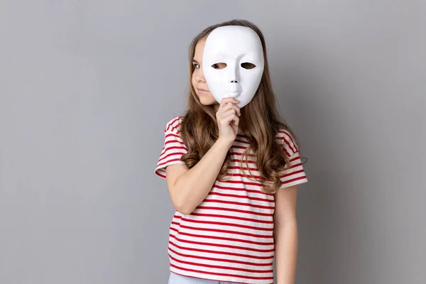 Portrait Dark Haired Little Cute Girl Wearing Striped Shirt Holding — Stockfoto