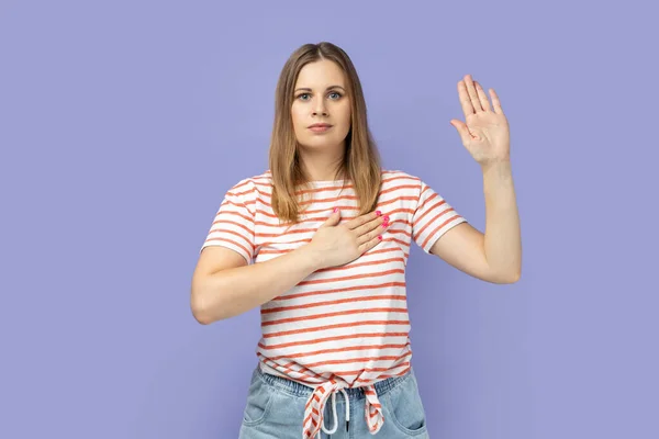 Portrait Serious Patriotic Blond Woman Wearing Striped Shirt Raising One — Stok fotoğraf