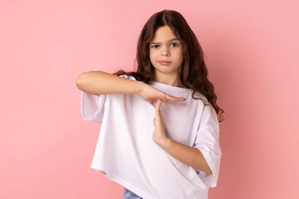 Portrait Serious Concentrated Little Girl Wearing White Shirt Showing Time — Stock Photo, Image