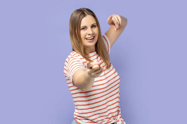 Portrait Positive Blond Woman Wearing Striped Shirt Standing Pointing Camera — Stock fotografie