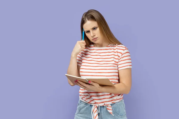 Portrait Pensive Thoughtful Blond Woman Wearing Striped Shirt Writing Paper — Zdjęcie stockowe