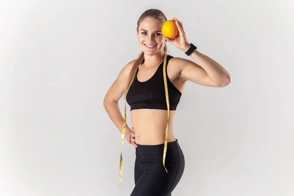 Portrait Smiling Confident Athletic Blonde Woman Standing Tape Measure Her — Stock Photo, Image