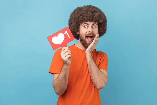 Portrait Cute Surprised Man Afro Hairstyle Wearing Orange Shirt Holding — Stock Photo, Image