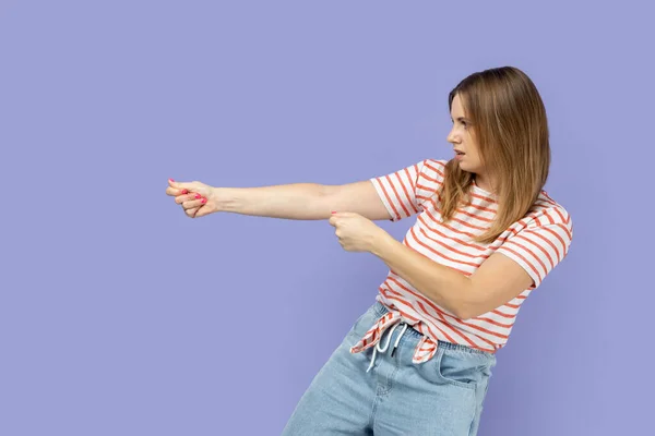Strong Ambitious Woman Wearing Striped Shirt Pretending Pull Invisible Rope — Stock Photo, Image