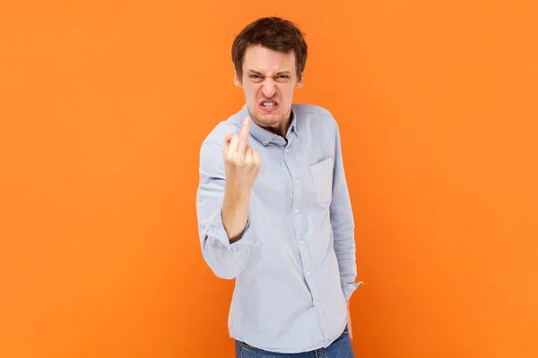 Portrait Crazy Man Shows Fuck You Sign Looking Poker Face — Stockfoto