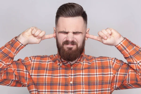 Portrait Annoyed Irritated Bearded Man Covering Ears Fingers Hearing Very — Stock Photo, Image