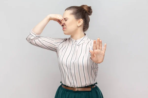 Portrait Disgusted Attractive Woman Wearing Striped Shirt Standing Turning Her — Stock Photo, Image