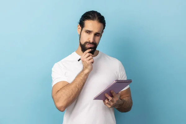 Portrait Thoughtful Man Beard Wearing White Shirt Holding Paper Notebook — Stock Photo, Image