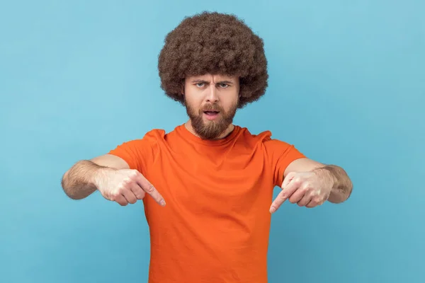 Portrait Man Afro Hairstyle Wearing Orange Shirt Pointing Fingers Commanding — Stock Photo, Image