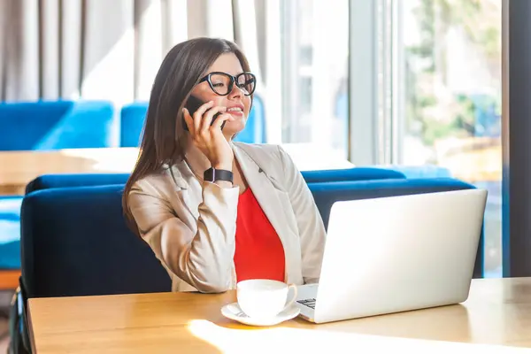Portrait Confident Woman Working Laptop Talking Smartphone Business Partners Positive Stock Picture
