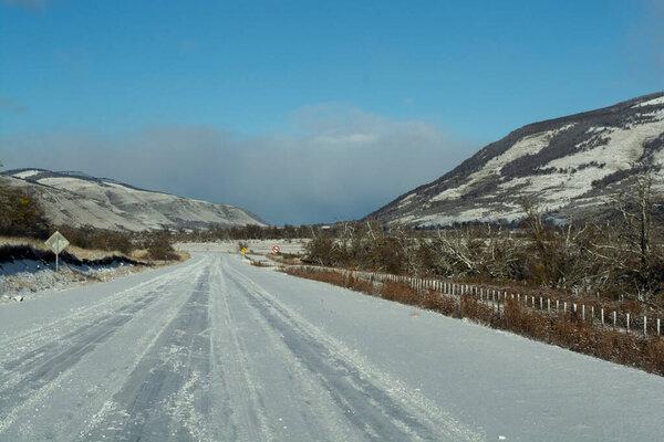 Snowy Road through the Patagonian Landscape near Ro Turbio, Argentina.