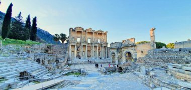 Izmir, Turkey, 01.01.2024, Tourists visiting the Library of Celsus is an ancient Roman building at the Ephesus Archaeological Site clipart