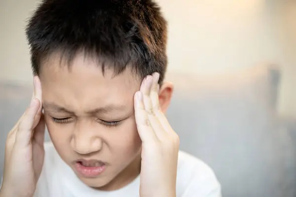 stock image Sick child boy suffering from acute headache,feel tired or exhausted,head pain and fever,illness,symptoms of Heat Headache or Summer Flu,disease of Hyperthermia or Heatstroke in children,health care