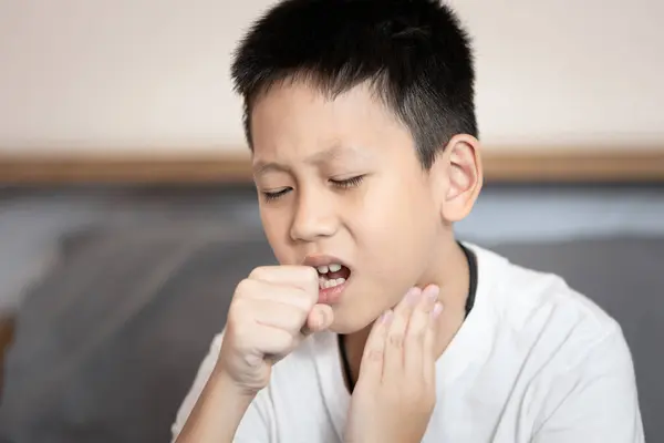 stock image Sick child boy suffering from coughing,sore throat,chronic cough with mucus,Acute bronchitis or chest cold,Pneumonia,Respiratory disease,infection or inflammation of the bronchial or lung in children