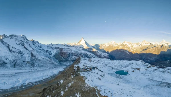 stock image Aerial drone flyover Gornergrat with Matterhorn view during autumn in Switzerland. Majestic mountain peaks iconic famous zermatt travel ski resort in the alps. Wonderful panorama nature landscape.