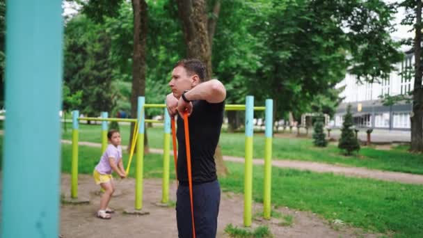 Middle Age Man Doing Strength Exercises Resistance Bands Outdoors Park — Stock Video