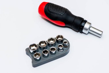 Screwdriver and set bits on white background, isolate