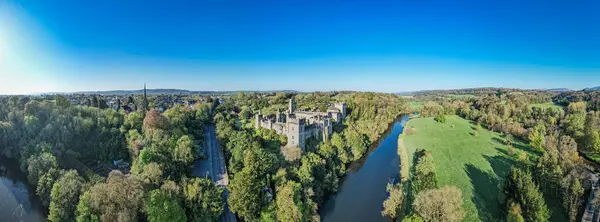 stock image An aerial panorama reveals the majestic Lismore Castle in County Waterford, Ireland, set against a flawless spring sky