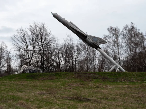 stock image An old monument of an old soviet fighter jet.