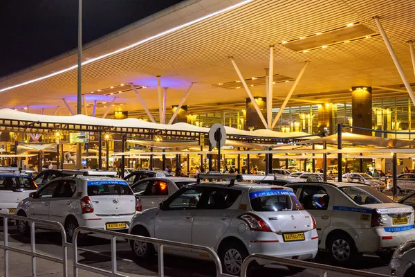 stock image Kempegowda International Airport Bengaluru Karnataka India August 6 September 2024 Kempegowda International Airport with passengers patronising food stalls and cabs at night in Bengaluru