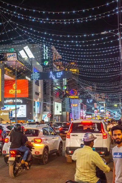 stock image Brigade Road Bengaluru Karnataka India September 11 2024 Busy lit up streets and shops and buildings at Brigade Church Street and MG road in Bangalore Bengaluru at night with traffic and pedestrians