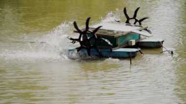 water turbine, oxygen turbine with a solar panel to generate power for treating wastewater in 4K, soft focus