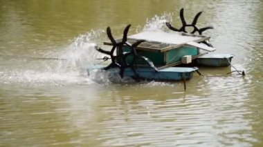 water turbine, oxygen turbine with a solar panel to generate power for treating wastewater in 4K, soft focus