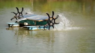 water turbine, oxygen turbine with a solar panel to generate power for treating wastewater in 4K, soft focus