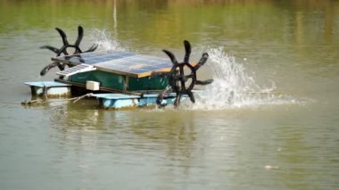 water turbine, oxygen turbine with a solar panel to generate power for treating wastewater in 4K, soft focus