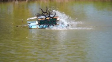 water turbine, oxygen turbine with a solar panel to generate power for treating wastewater in 4K, soft focus