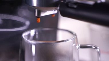 close-up of Coffee foam. espresso crema comes out of the fully automatic coffee machine, Making the coffee machine into a cup.