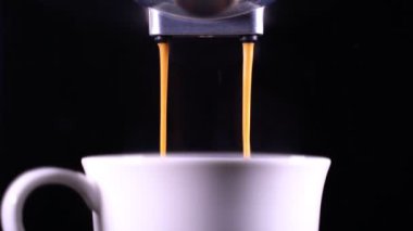 close-up of Coffee foam. espresso crema comes out of the fully automatic coffee machine, Making the coffee machine into a cup.