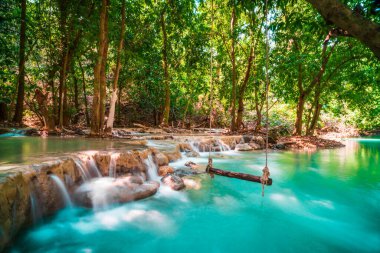 Hot Springs Onsen Natural Bath is Surrounded by red-yellow leaves. In fall leaves, Waterfall among many foliages, In fall leaves Leaf color change