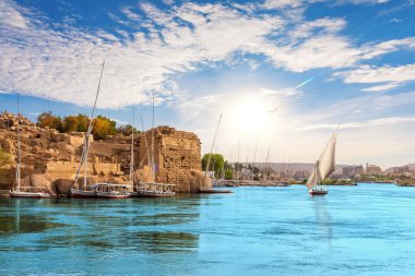 Traditional view of Aswan with sailboats in the Nile, Egypt.