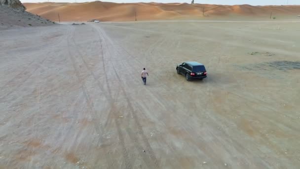 Drone Flies Man Walking Empty Road Overtaken Suv — Video