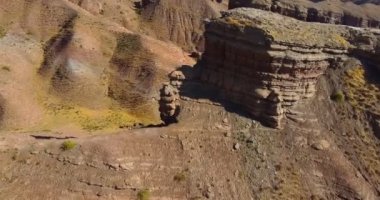 Drone flyby over a mountain on a cloudless summer day. Aerial