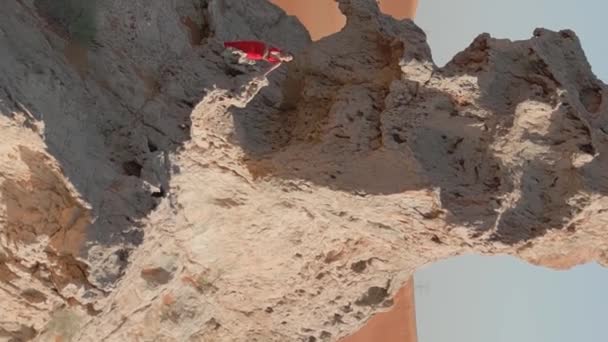 Drone Flies Young Woman Red Dress Standing Cliff Middle Desert — Stock Video