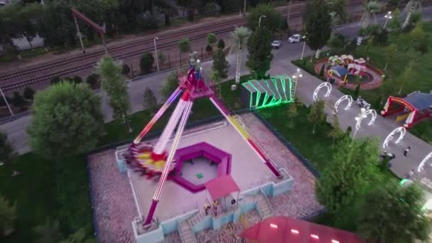 Drone Flies Amusement Park Rides Carousels Night Aerial View — Stock Video