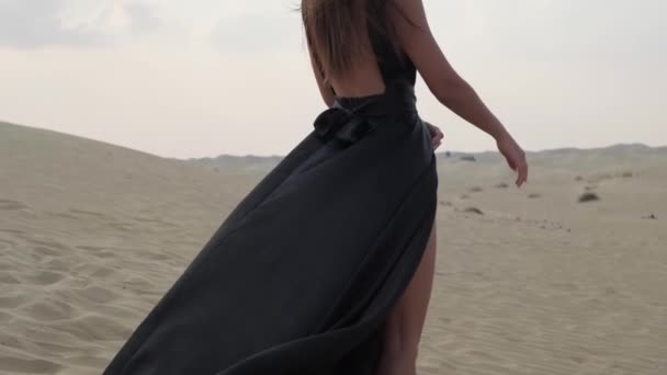 Young Woman Long Hair Elegant Black Dress Walking Barefoot Sand — Stockvideo