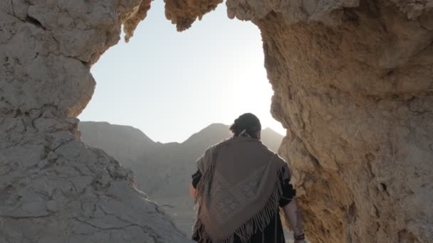 Young Bearded Shaman Prays While Standing Grotto Rock Sand Dunes — Stock Video