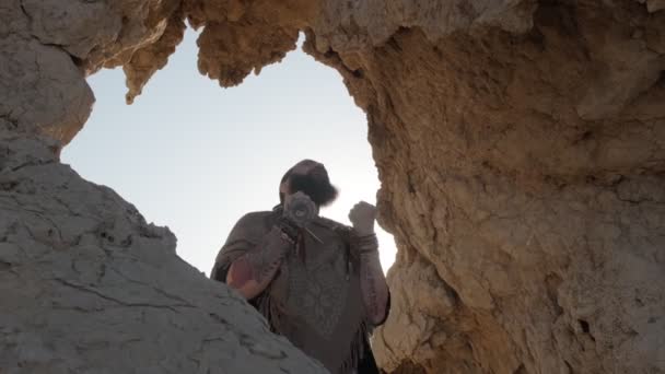 Young Bearded Shaman Prays While Standing Grotto Rock Sand Dunes — Stock Video