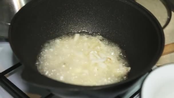 Elderly Woman Puts Chopped Onions Cauldron Boiling Oil Kitchen Gas — Stock Video